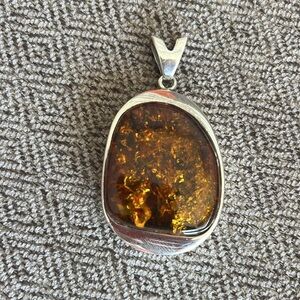 Silver and amber pendant